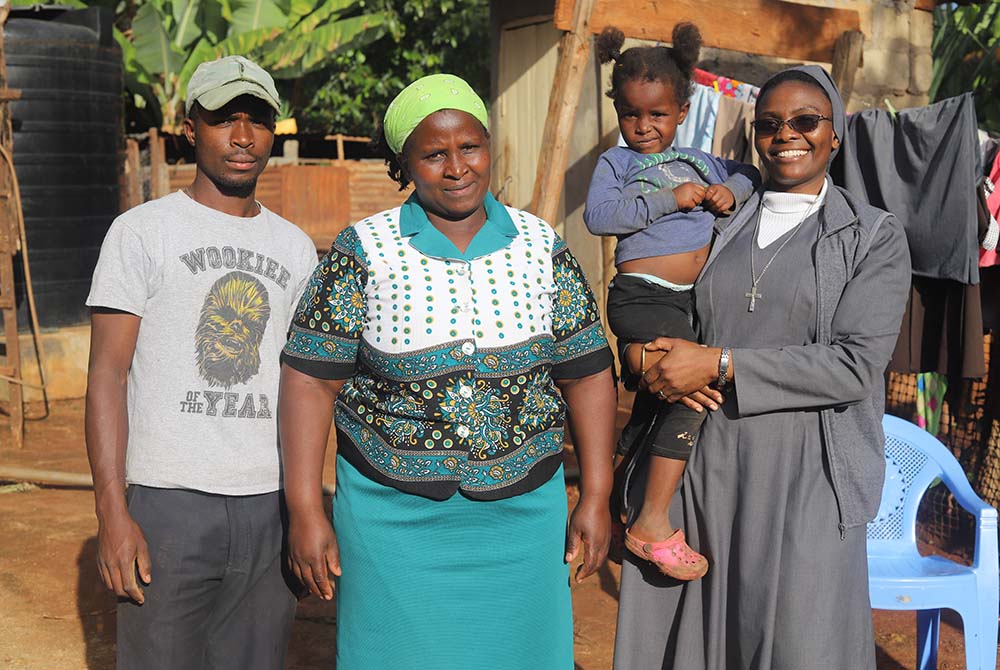Sr. Gisele Mashauri interacts with Grace Wamboi and her children at their home in Makuyu village, located some 37 miles northeast of Nairobi. Wamboi is a member of Savings and Internal Lending Communities. (GSR photo/Doreen Ajiambo)