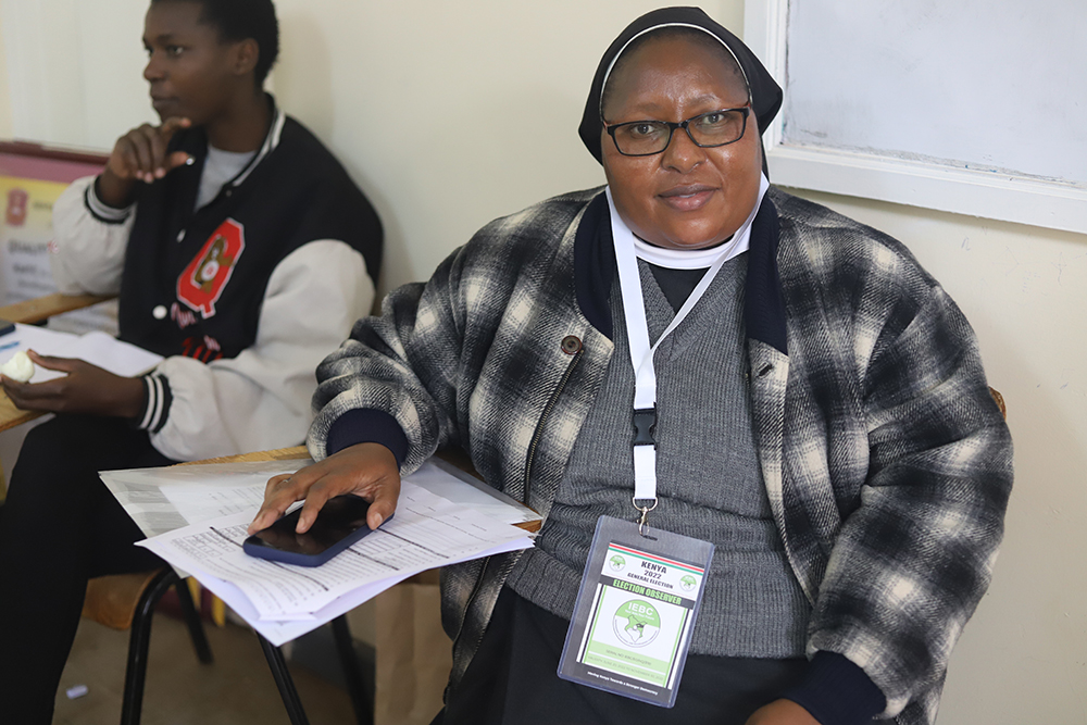 Sr. Catherine Muthoki Mutuku of the Missionary Benedictine Sisters works as an elections observer at the Karen Kenya Medical Training College polling station in Nairobi, Kenya, during Kenya's Aug. 9 general election. Observers give an accurate and imparti