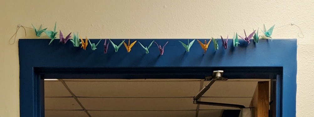 The cranes the seventh-graders made hang above the classroom door to remind students to enter and leave the classroom with a positive and peaceful attitude, just like Sadako. (Samantha Kominiarek) The cranes the seventh-graders made hang above the classroom door to remind students to enter and leave the classroom with a positive and peaceful attitude, just like Sadako. (Samantha Kominiarek)