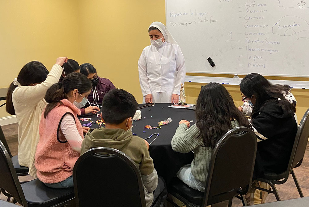 Sr. Ignacia García Ramos teaches an afterschool faith formation class for elementary school students in March at Centro de San Juan Diego in Lexington, Kentucky. (Courtesy of Luz Bejarano)