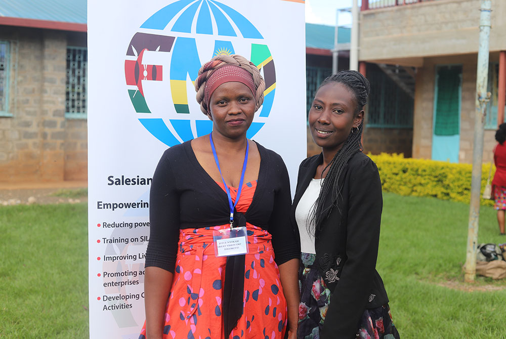 From left: Joyce Nyokabi, 34, and Damaris Wairimu, 32, interact after attending a conference on women empowerment in Makuyu village. The conference was organized by the Salesian Sisters of Don Bosco, which aims to help alleviate poverty among women and im
