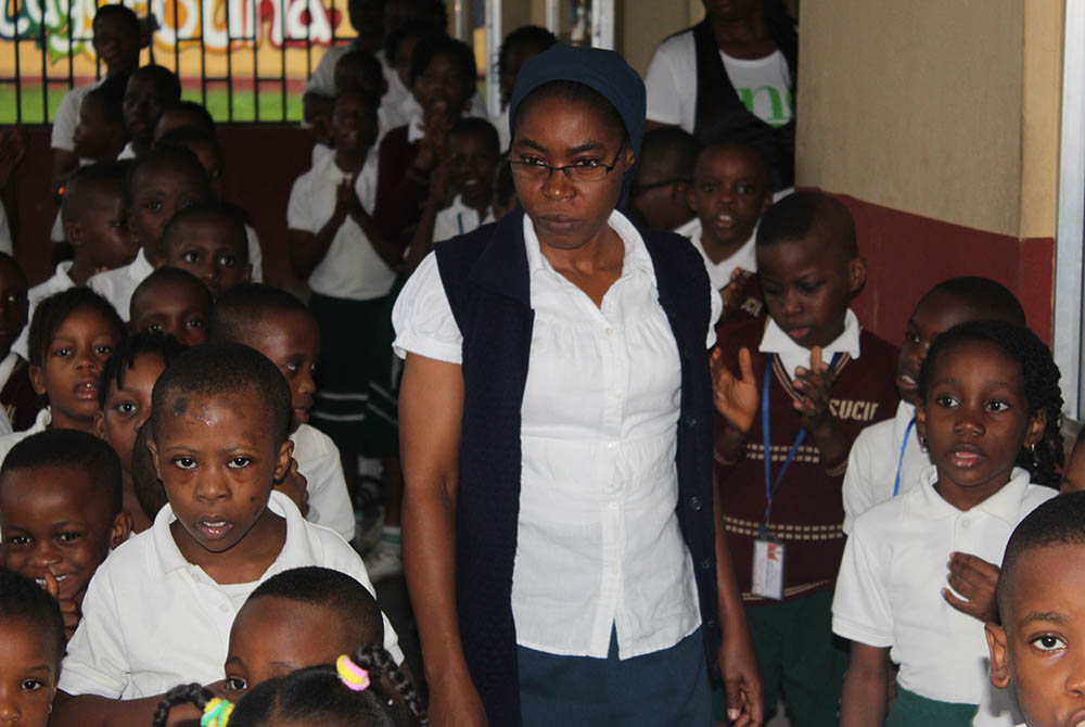 Sr. Martha Oko prepares the pupils on the assembly ground for morning devotion at St. Vincent's Centre for Inclusive Education, run by the Daughters of Charity in Uyo, state capital of Akwa Ibom in Southern Nigeria. (Kelechukwu Iruoma)