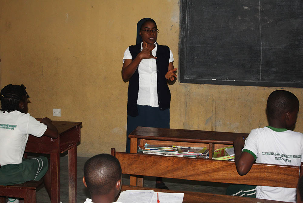 Sr. Martha Oko uses sign language to teach pupils at St. Vincent's Centre for Inclusive Education, run by the Daughters of Charity in Uyo, state capital of Akwa Ibom in Southern Nigeria. (Kelechukwu Iruoma)