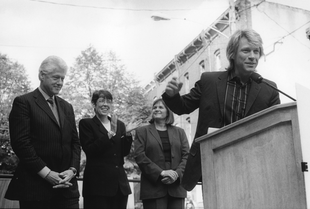 From left: President Bill Clinton, Mercy Sr. Mary Scullion, Joan Dawson McConnon, and Jon Bon Jovi at the 2006 dedication of a new Project HOME building in Philadelphia (Courtesy of Project HOME/Harvey Finkle)
