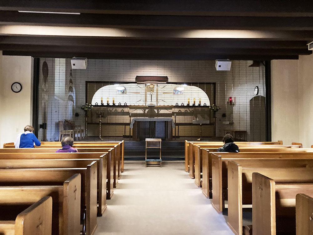 A handful of people visit the chapel on Dec. 8, 2021, for midday prayer at the Monastery of the Angels in Los Angeles. (RNS/Alejandra Molina)