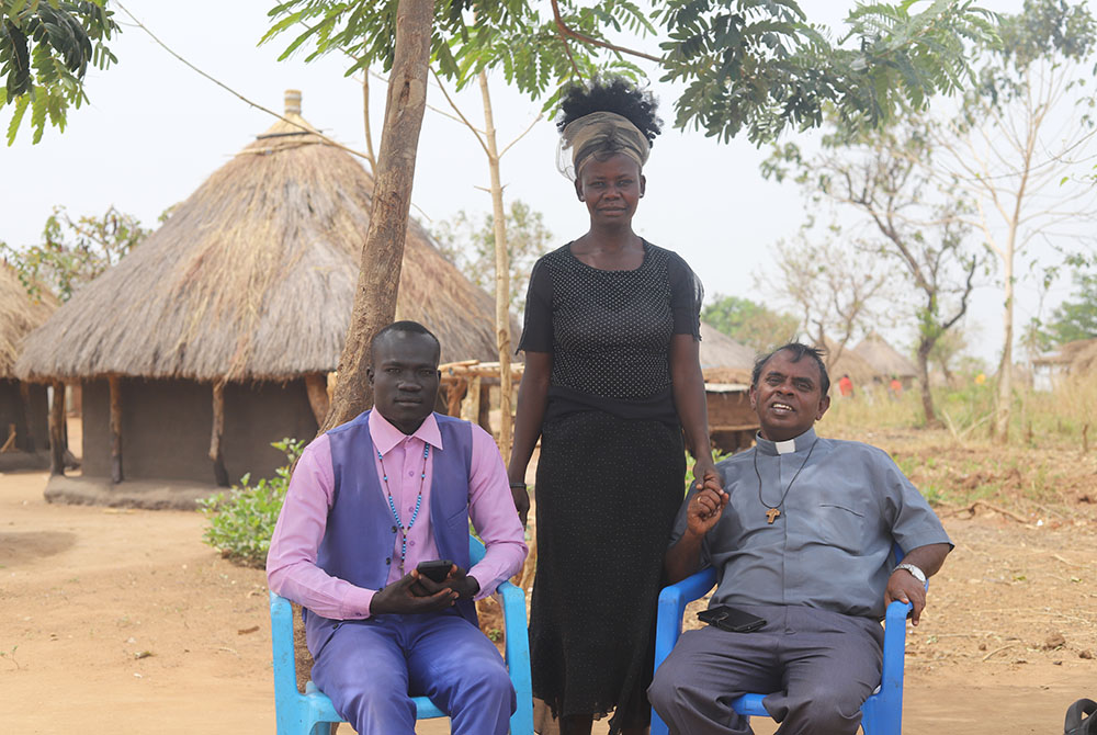 From right: Salesian Fr. Lazar Arasu, Rose Geno and catechist Olaa Bosco are pictured at Palabek refugee camp in northern Uganda. (GSR photo/Doreen Ajiambo)