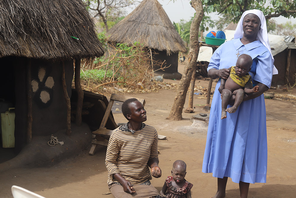 Sr. Lucy Akera of the Little Sisters of Mary Immaculate of Gulu visits one of the families that benefited from her agricultural skills and support, and started farming to mitigate food shortage at the Palabek refugee camp in northern Uganda amid the pande