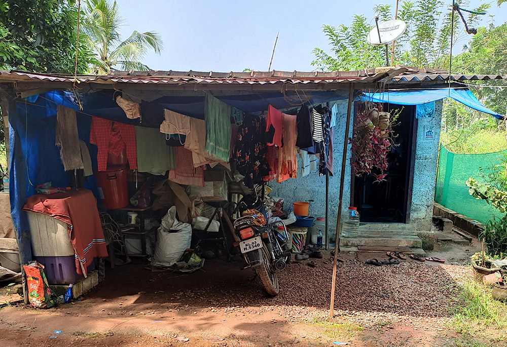 The one-room shed where a day laborer and his wife and daughter were living, when Rose Cherian Vachaparampil began the "live crib" project to build a house for the family (Courtesy of Rose Cherian Vachaparampil)