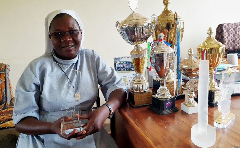 Sr. Rose Nelima displays some of the accolades her students have earned. (Gerald Matembu)