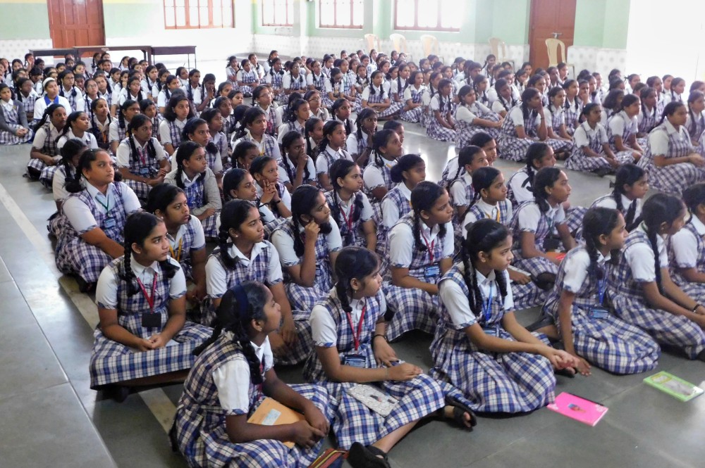 A group of students listen to Franciscan Hospitaller Sr. Rosita Gomes on devotion to Mary in October at Mary Immaculate School, Panaji, capital of the western India state of Goa. (Provided photo) A group of students listen to Franciscan Hospitaller Sr. Rosita Gomes on devotion to Mary in October at Mary Immaculate School, Panaji, capital of the western India state of Goa. (Provided photo)