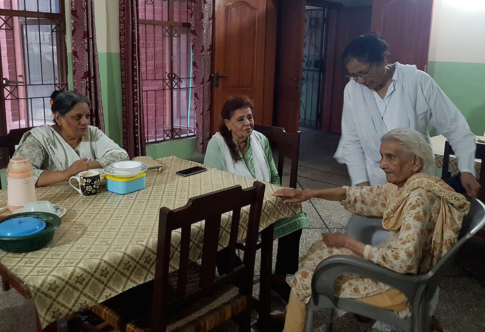 Sr. Sabina Barkat, standing, with residents of Shakina Home for the Aged in Youhanabad, Lahore, Pakistan (Kamran Chaudhry)