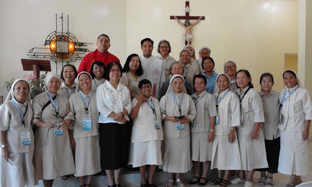The vow day of Christian Community Srs. Rosa Ocampo and Cornelia Santos in Bohol, Philippines, on April 25, 2016. Santos is fourth from left in the first row; Ocampo is behind her between the two priests. (Courtesy of Rosa Ocampo)