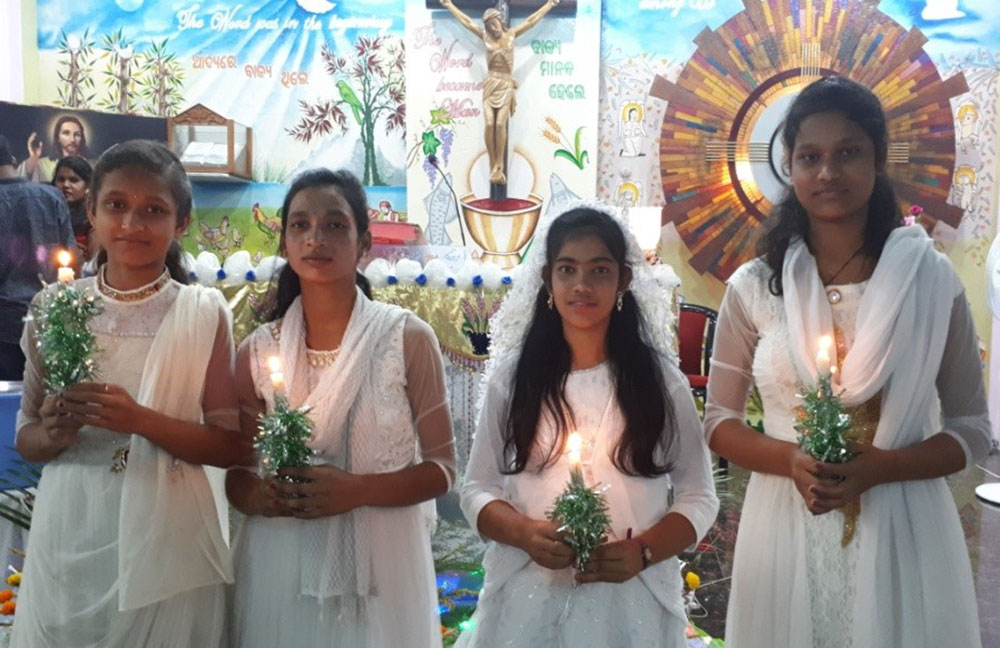 Asha Bhavan girls are seen on the day of their first Communion. (Courtesy of Shanti Pulickal) Asha Bhavan girls are seen on the day of their first Communion. (Courtesy of Shanti Pulickal)