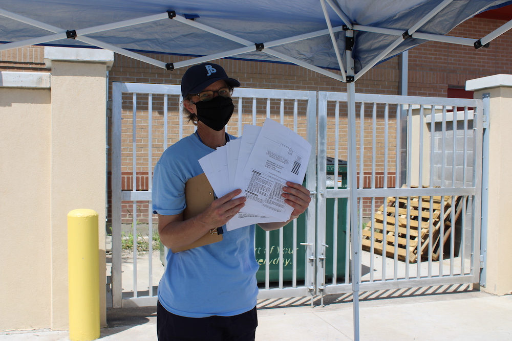 Daughters of Charity Sr. Sharon Horace displays voter registration documents at the event at Proyecto Juan Diego in Brownsville, Texas, on National Voter Registration Day, Sept. 22. (Provided photo)