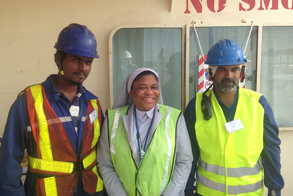 Sr. Joanna Okereke, center, is a Sister of the Handmaids of the Holy Child Jesus and the national director of the Stella Maris ministry of the U.S. bishops' conference. She and chaplains and volunteers run errands for seafarers; they learn what the crews' Sr. Joanna Okereke, center, is a Sister of the Handmaids of the Holy Child Jesus and the national director of the Stella Maris ministry of the U.S. bishops' conference. She and chaplains and volunteers run errands for seafarers; they learn what the crews'