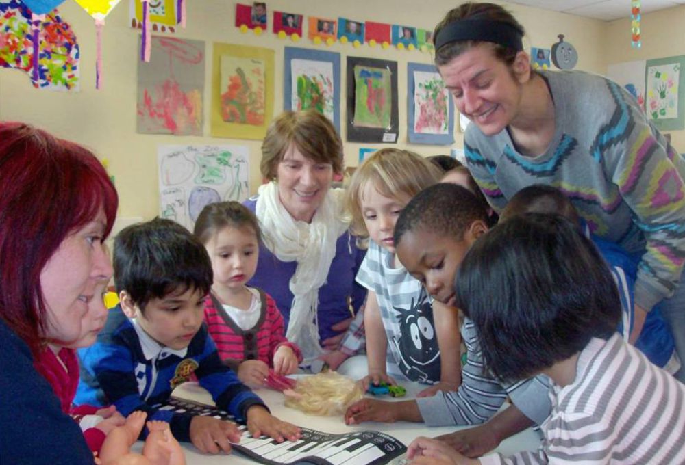 Daughter of Wisdom Sr. Grainne Hilton, center, with families in Sophia Housing's Cork Street project in Dublin (Provided photo)