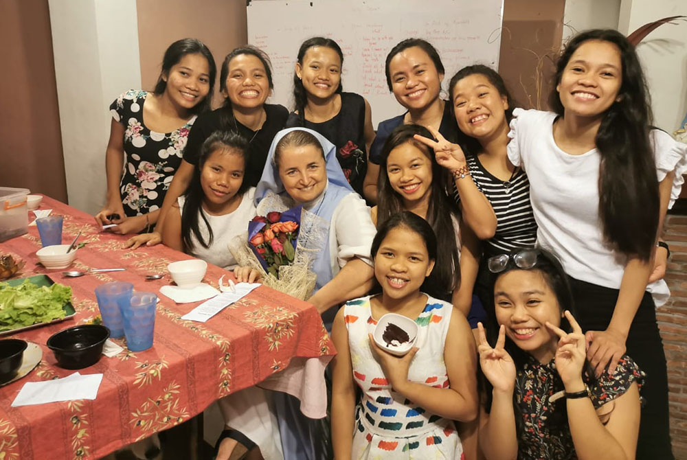 Sr. Sophie de Jésus of the Missionaries of Mary celebrates the feast of the Sacred Heart in June 2020 with some of girls at the School of Life, a residential program that she founded in the Philippines in 2000 for girls ages 14 to 21 to learn life skills 