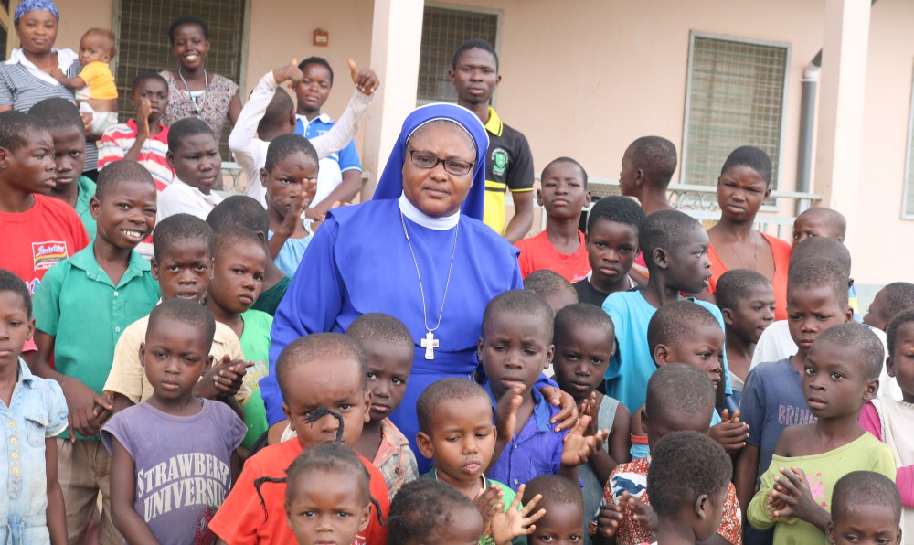 Sr. Stan Therese Mumuni poses for a photo surrounded by children at Nazareth Home for God's Children in northern Ghana. (Doreen Ajiambo)