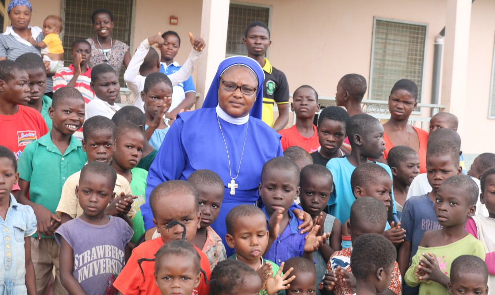 Sr. Stan Therese Mumuni poses for a photo surrounded by children at Nazareth Home for God's Children in northern Ghana. (Doreen Ajiambo) Sr. Stan Therese Mumuni poses for a photo surrounded by children at Nazareth Home for God's Children in northern Ghana. (Doreen Ajiambo)