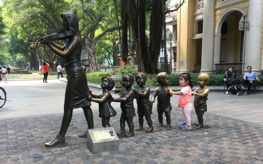 Teagan (Tian Xin Yue) plays at a sculpture on Shamian Island in Guangzhou, China. (Courtesy of the Worley family)