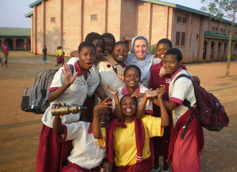 Canossian Sr. Melissa Dwyer poses with students at Bakhita Secondary School in Balaka, Malawi, where Dwyer was principal for seven years, in 2009. (Courtesy of Melissa Dwyer)
