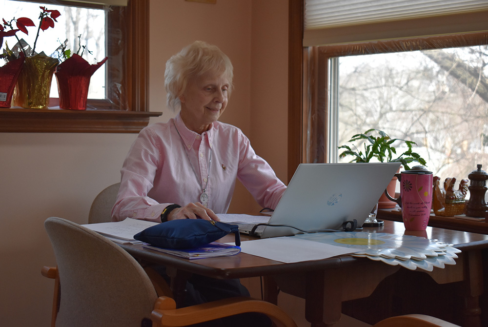 Sr. Suzanne Susany of the Sisters of St. Francis of the Neumann Communities assists immigrants from home in Pittsburgh during the pandemic. (Julie A. Ferraro)