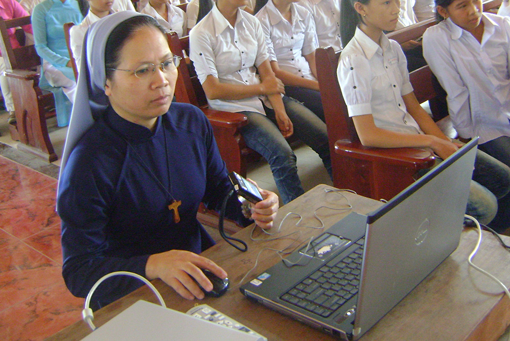 Teresa Truong Thi Thao Nhi Daughters of Mary Immaculate Sr. Teresa Truong Thi Thao Nhi teaches health to young Catholics in Cau Hai Parish in Hue in April. (Peter Nguyen)