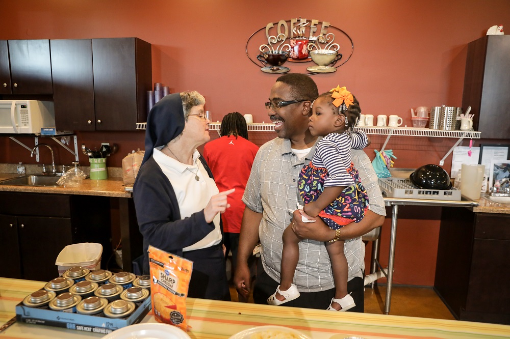 Sr. Theresa Sullivan, left, thanks Reverend Spencer for the meal his congregation provides at Daybreak Day Resource Center in Macon, Georgia, each month. (Provided photo) Sr. Theresa Sullivan, left, thanks Reverend Spencer for the meal his congregation provides at Daybreak Day Resource Center in Macon, Georgia, each month. (Provided photo)