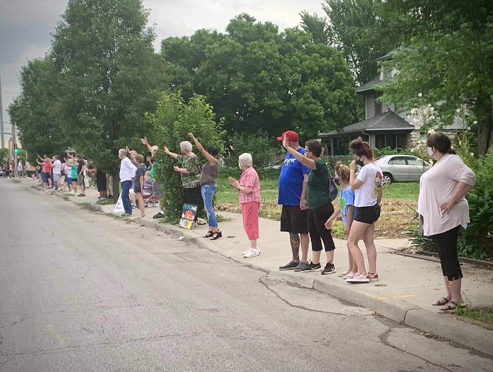 People line up along Troost Avenue in Kansas City, Missouri, for the Pray on Troost event on Juneteenth. People line up along Troost Avenue in Kansas City, Missouri, for the Pray on Troost event on Juneteenth.