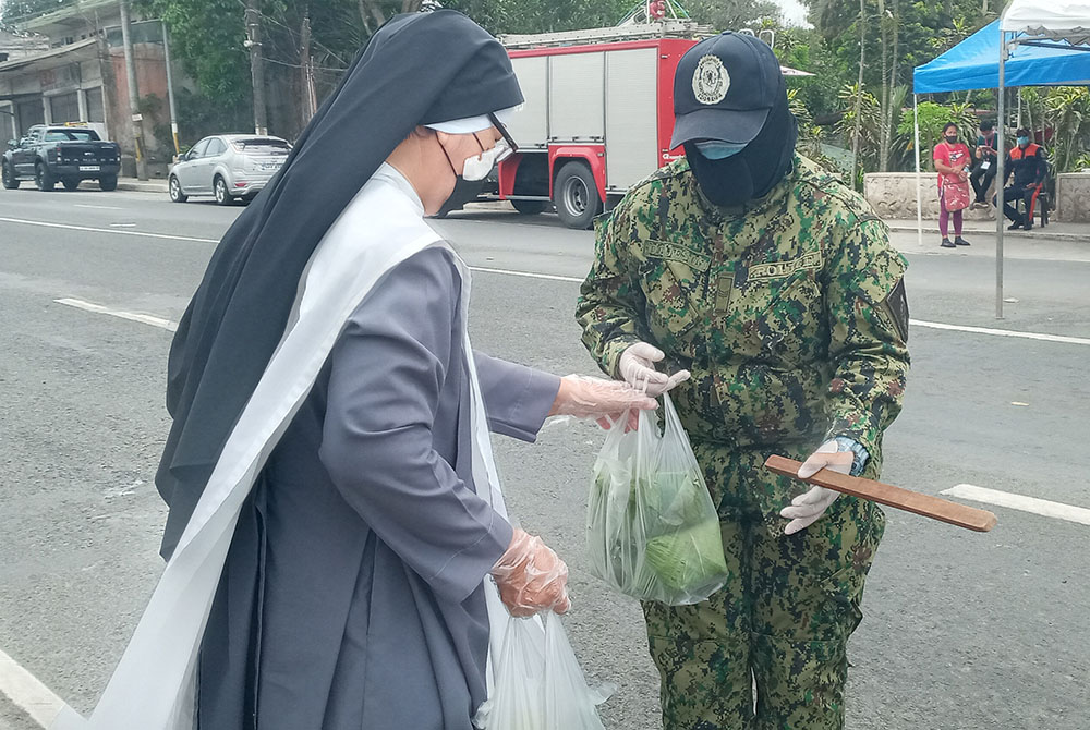 Since the start of the pandemic the Congregation of the Daughters of St. Dominic in the Philippines added ministry in which they cooked and packed lunch daily for the parish priest, assistants, seminarians, doctors, nurses and medical staff, guards, maint Since the start of the pandemic the Congregation of the Daughters of St. Dominic in the Philippines added ministry in which they cooked and packed lunch daily for the parish priest, assistants, seminarians, doctors, nurses and medical staff, guards, maint