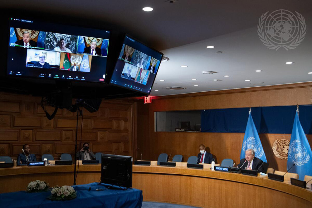 Secretary-General António Guterres, seated between flags, opens the 2021 United Nations Food Systems Summit on Sept. 23 at U.N. Headquarters in New York. (U.N. photo/Eskinder Debebe)