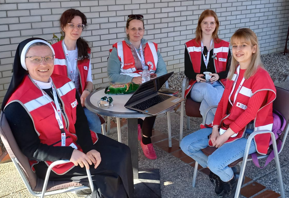 Sister Veronica Galatan, left, serves as a part of a Red Cross team consisting of a psychologist, a translator and student volunteers. (Courtesy of Sisters of St. Basil the Great) Sister Veronica Galatan, left, serves as a part of a Red Cross team consisting of a psychologist, a translator and student volunteers. (Courtesy of Sisters of St. Basil the Great)