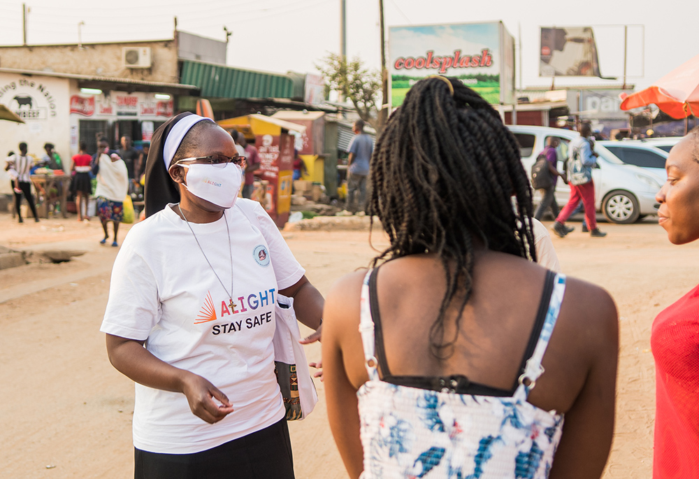 Sr. Astridah Banda, a Dominican Missionary Sister of the Sacred Heart of Jesus, carries a COVID-19 vaccine awareness campaign in the streets of Lusaka, Zambia's capital. (Derrick Silimina)