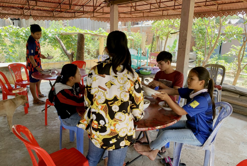 Young people finish lunch and help with chores at the Catholic youth center in Stung Treng, Cambodia. Located a little more than a mile from the church, the center has a dormitory, a study room and dining room. (Akarath Soukhaphon)