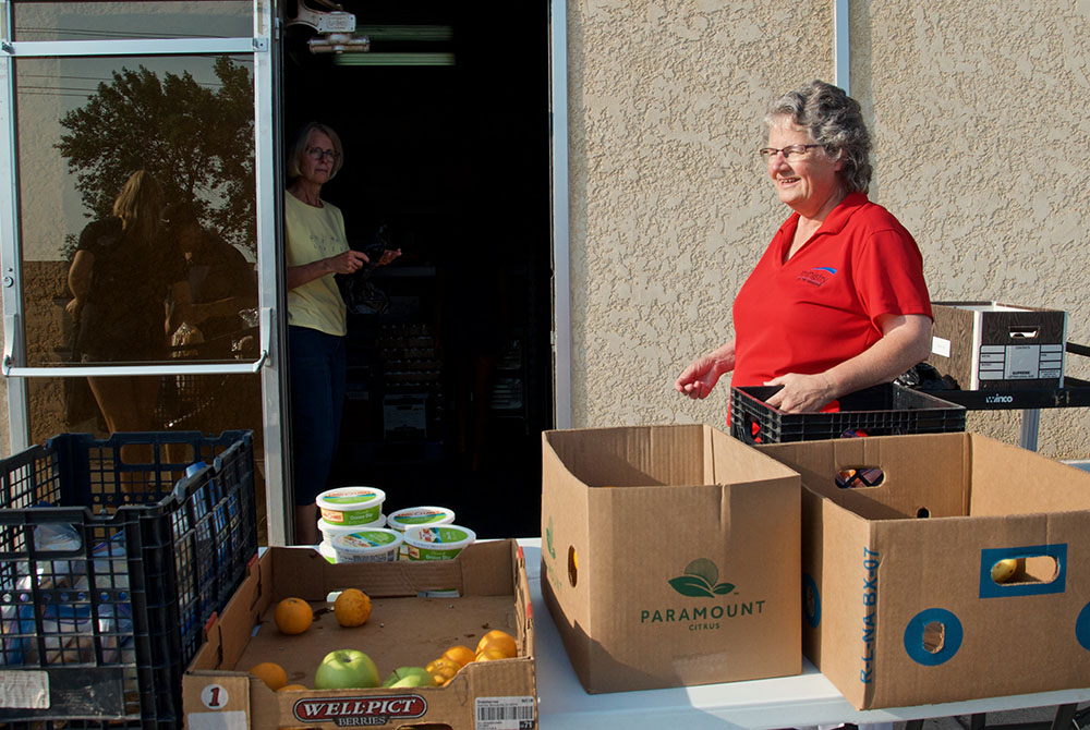 Benedictine Sr. Kathleen Atkinson supervises the food pantry at Ministry on the Margins in Bismarck, North Dakota. (GSR photo/Dan Stockman) 
