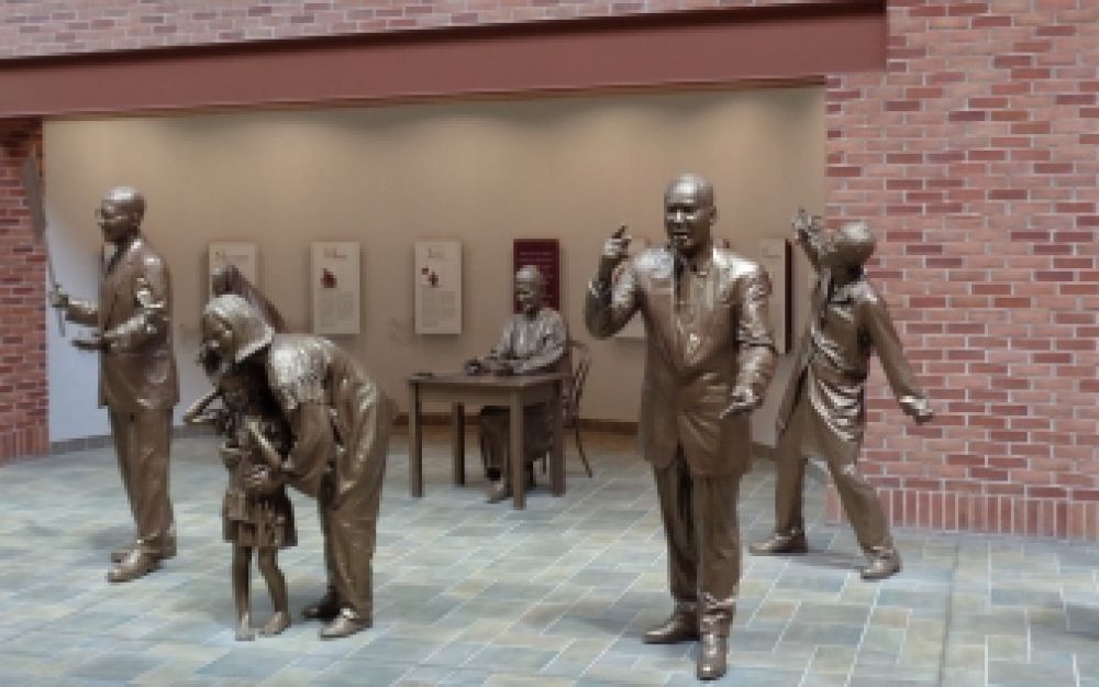 The Solanus Casey Center in Detroit (the Capuchin Province of St. Joseph monastery) has a group of statues that welcome you when you come in; they represent persons who lived the Gospel
