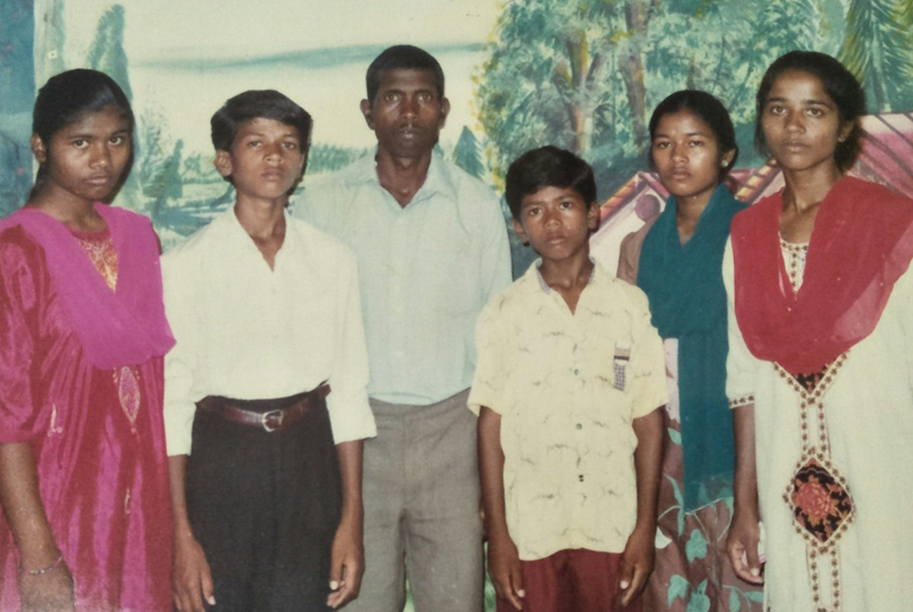 Sister Poonam, far right, is pictured with her family in a 1994 photo taken after the death of her mother. Also pictured, from left: her sister Sukrita, brother Sanju, father Cornelius, youngest brother Manoj, and her sister Anita. (Courtesy photo) Sister Poonam, far right, is pictured with her family in a 1994 photo taken after the death of her mother. Also pictured, from left: her sister Sukrita, brother Sanju, father Cornelius, youngest brother Manoj, and her sister Anita. (Courtesy photo)