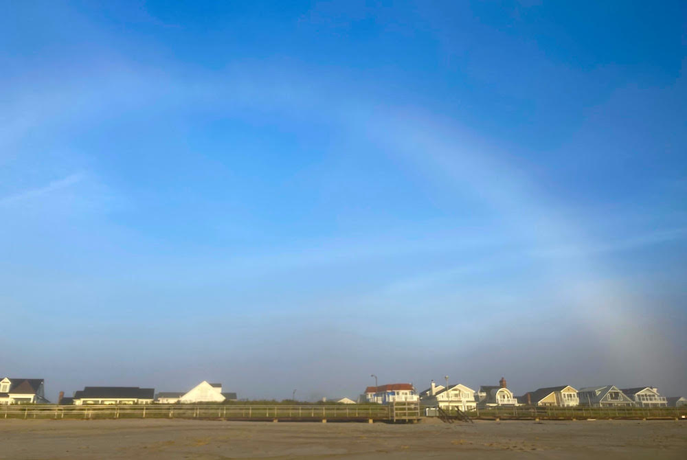 White arc in blue sky