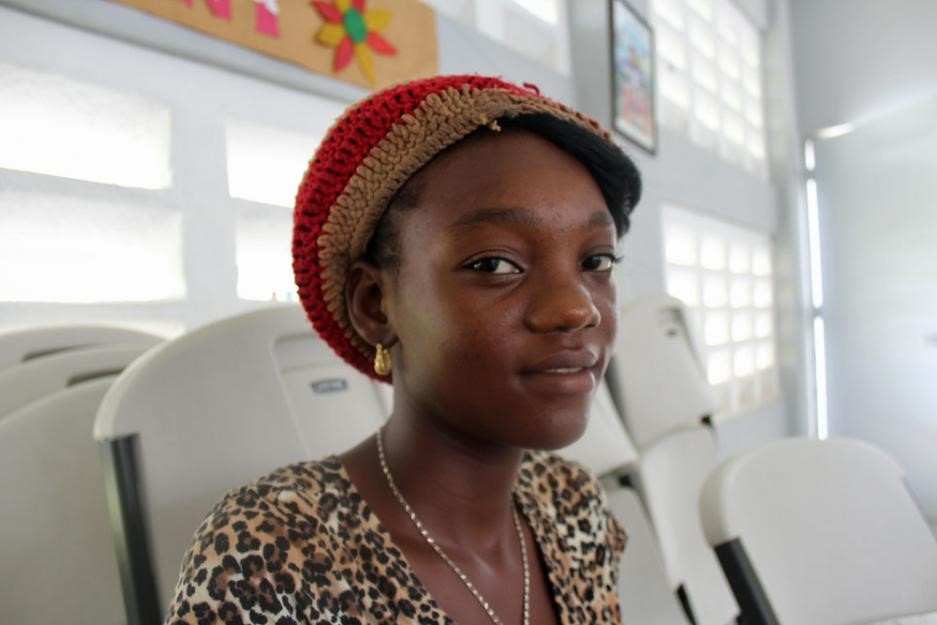 Prospelanda Aime smiles inside a church-run shelter. Prospelanda Aime smiles inside a church-run shelter.