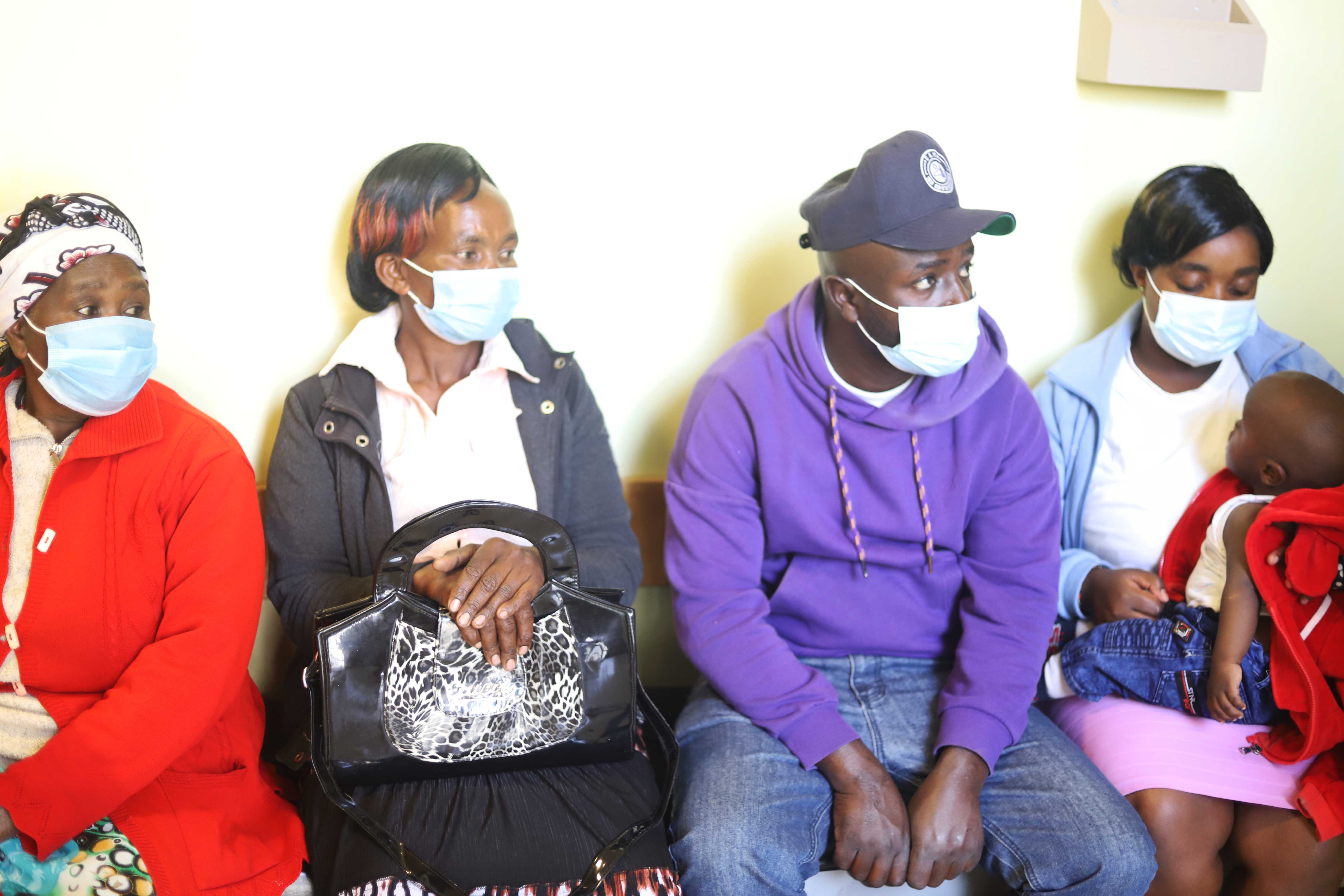 Patients sit on the benches along the hospital corridors as they wait to be attended to by the doctor at St. Joseph Hospital June 2 in Gilgil, in southwestern Kenya. Dr. William Fryda opened the hospital after the fallout between him and the Assumption Si