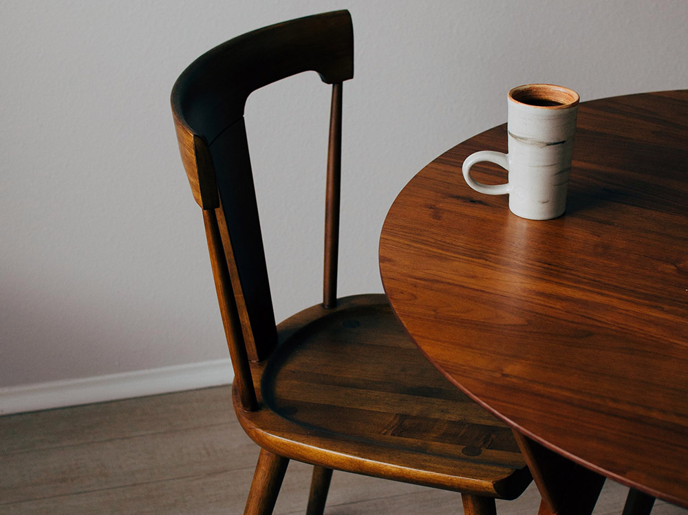 At the table (Unsplash/Ryan Riggins)