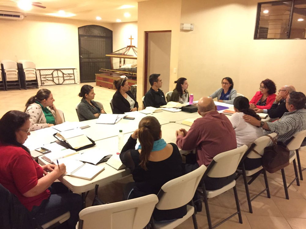Sr. Alexandra (at the head of the table, with glasses) during a session of one of the Bible courses. (George Rodriguez)