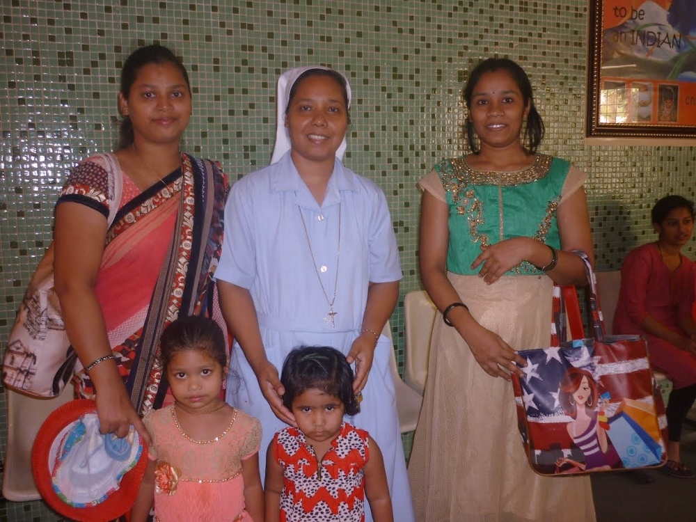Sr. Phoolmani Lakra, center, a member of the Sisters of the Charity of St. Anne, with Gita Patel, left, and Kalpana Dhile, former students who came to visit Ankur with their children. (GSR photo / Lissy Maruthanakuzhy)
