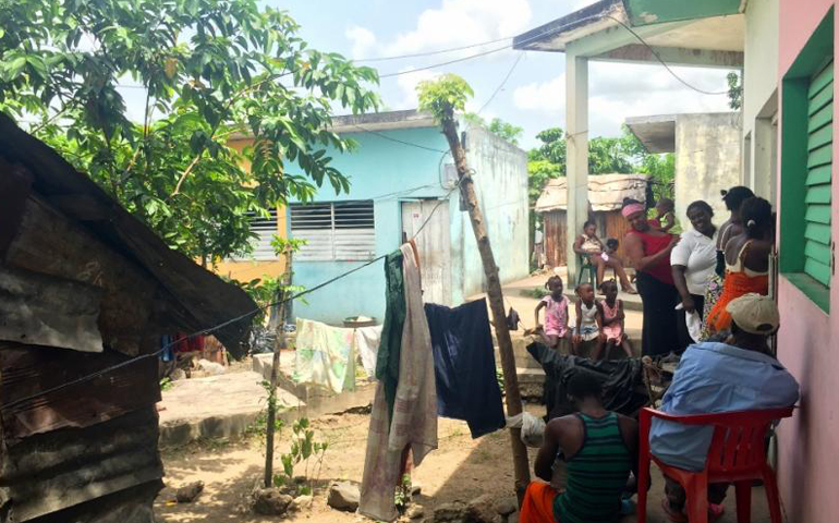 Residents of the Cambalache bateye in Consuelo, Dominican Republic, line up for health screenings. (GSR/Soli Salgado)