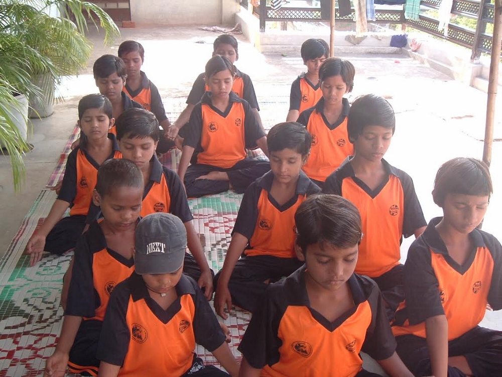 Jeevodaya children are instructed in yoga meditation. (Photo provided by Jeevodaya Society)