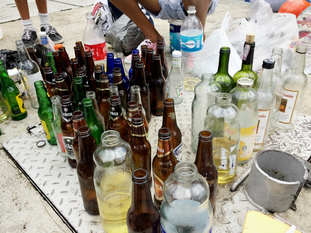 Bottles to be used for Molotov cocktails, prepared by young masked men to use against security forces during anti-government protests in Caracas, Venezuela. (Cody Weddle)