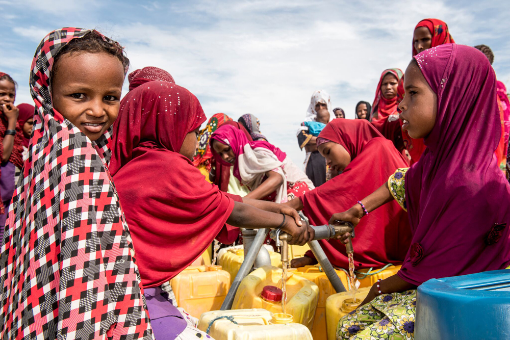 In Kindjani, Niger, people collect water Sept. 12, 2016, that was delivered to the community by Catholic Relief Services. (CNS photo/Michael Stulman, CRS)