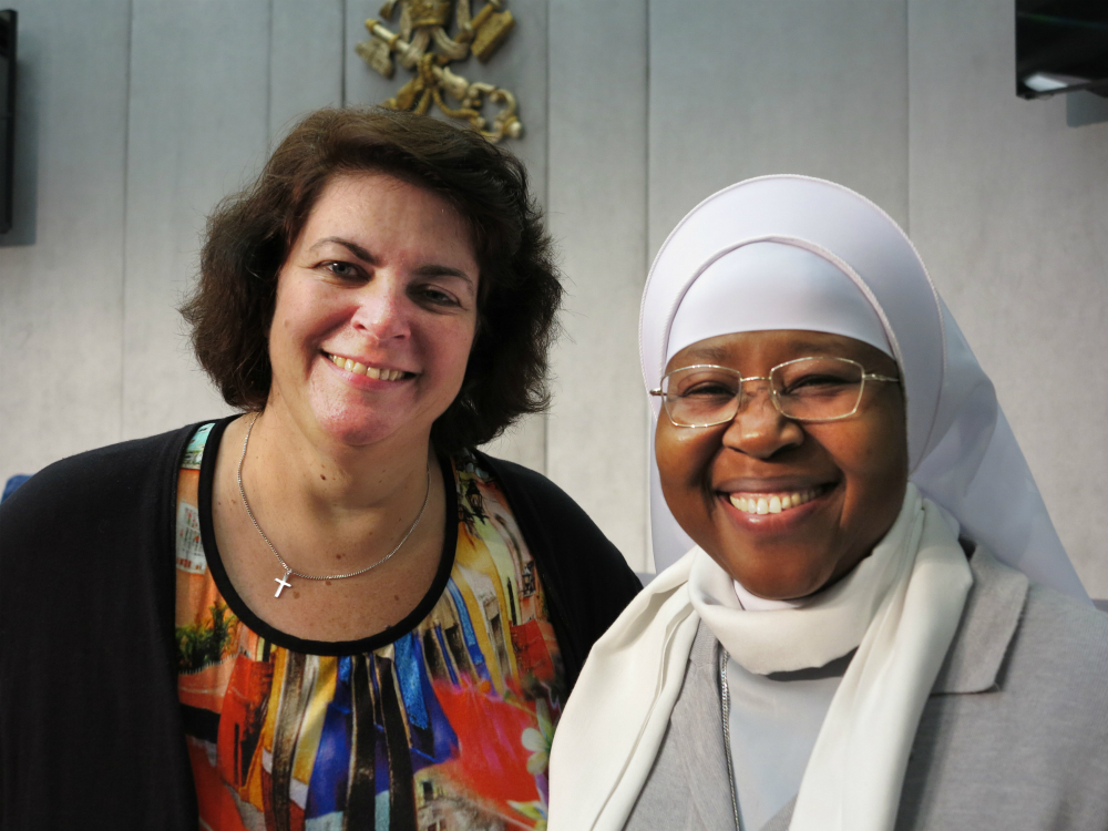 Ivonne van de Kar, an anti-trafficking advocate from the Netherlands, is seen at the Vatican press hall with Sister Monica Chikwe, a member of the Hospitaler Sisters of Mercy, who works with trafficked Nigerian women, Nov. 4. (CNS photo / Carol Glatz)