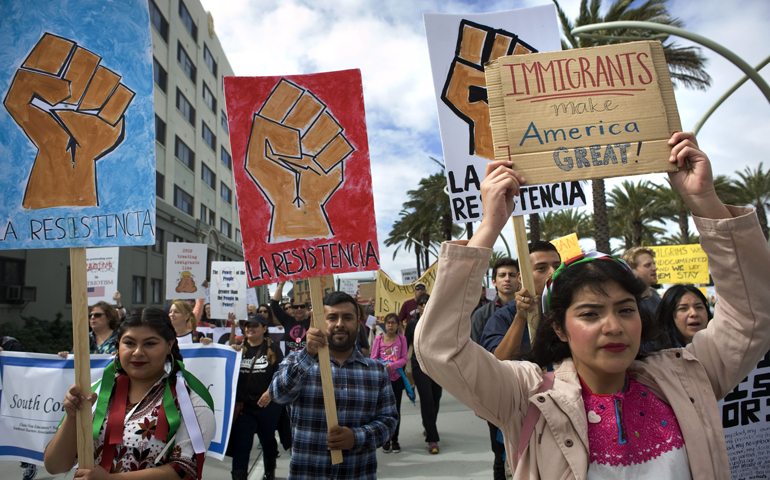 People in San Diego demonstrate in support of migrants and refugees Feb. 18. (CNS/David Maung, EPA) 