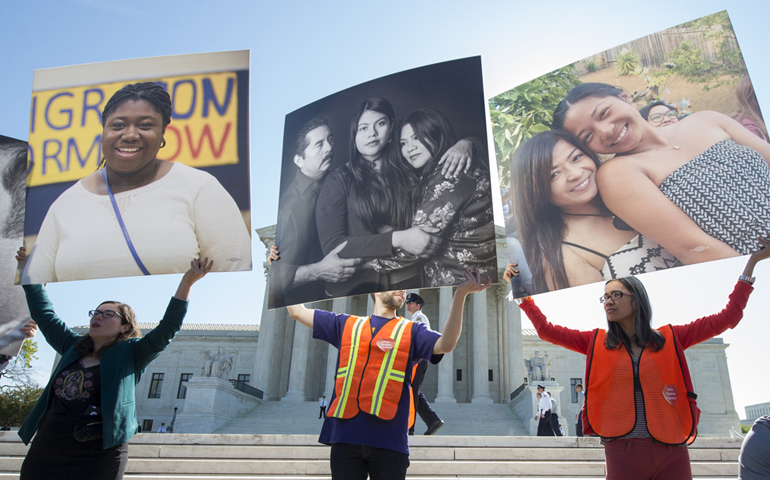 Immigration supporters are seen outside the Supreme Court April 18, 2016. (CNS photo / Michael Reynolds, EPA)